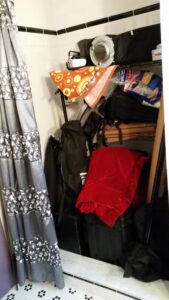 A cluttered shower stall.